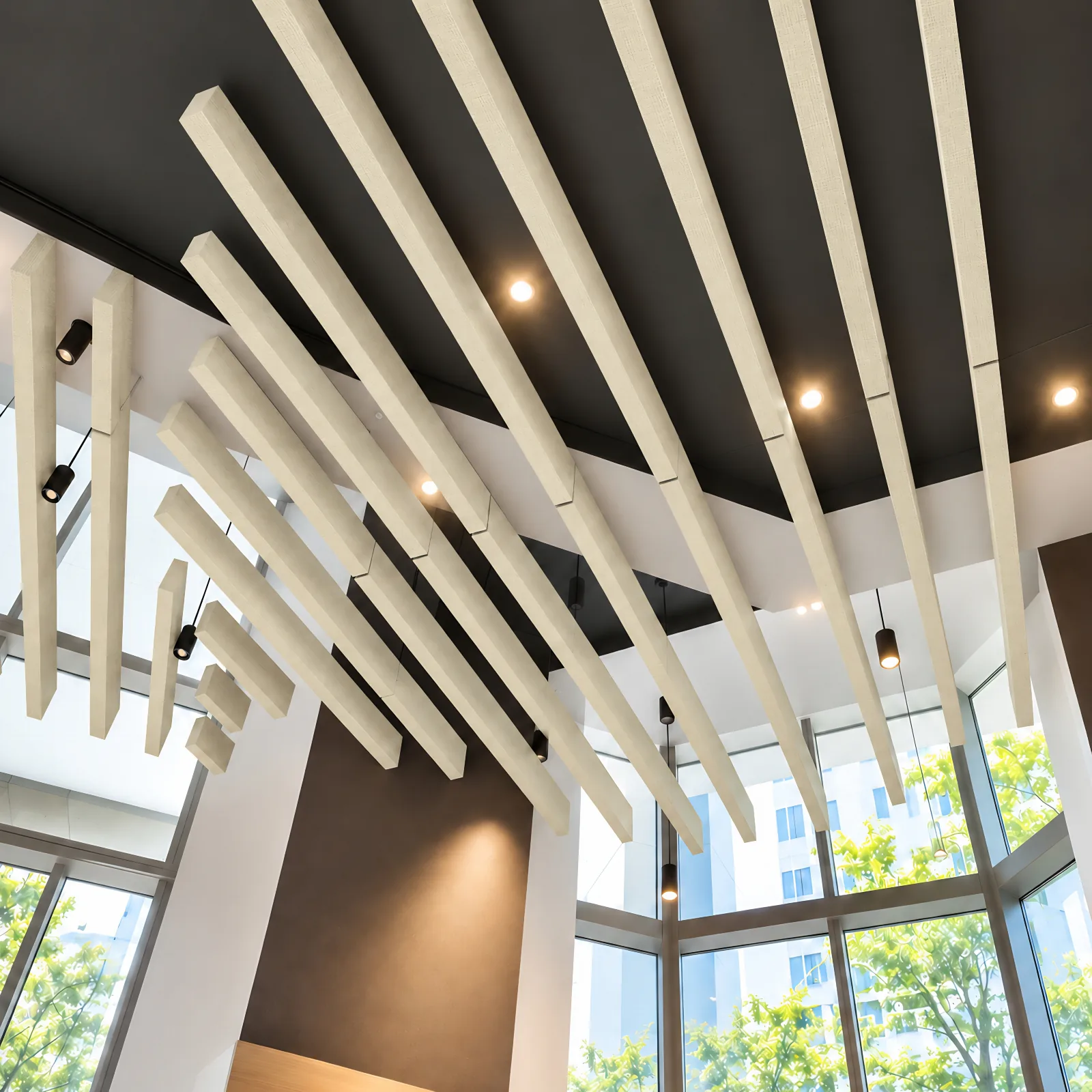 Long cream hanging sound baffles fanned across a dark ceiling in a glass atrium lobby